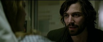 Movie still from “The Age of Adaline” (2015), directed by Lee Toland Krieger – A person with long hair and a beard; Close Up shot, Over the shoulder angle