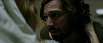 Movie still from “The Age of Adaline” (2015), directed by Lee Toland Krieger – A person with long hair and a beard; Close Up shot, Over the shoulder angle