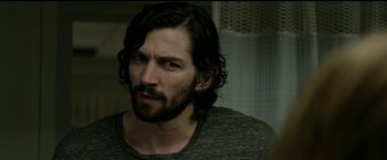 Movie still from “The Age of Adaline” (2015), directed by Lee Toland Krieger – A person with long hair and a beard; Close Up shot, Over the shoulder angle