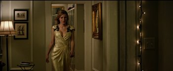 Movie still from “The Age of Adaline” (2015), directed by Lee Toland Krieger – A woman in a gold dress walking in a hallway; Medium shot, Low angle