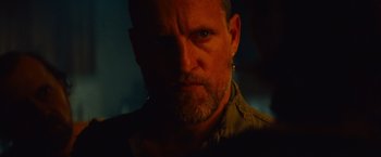 Movie still from “Out of the Furnace” (2013), directed by Scott Cooper – A person with a beard; Close Up shot, Over the shoulder angle