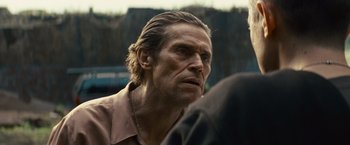 Movie still from “Out of the Furnace” (2013), directed by Scott Cooper – A person wearing a shirt; Close Up shot, Over the shoulder angle