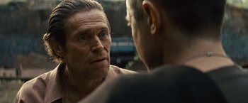 Movie still from “Out of the Furnace” (2013), directed by Scott Cooper – A person looking at another person; Close Up shot, Over the shoulder angle