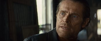 Movie still from “Out of the Furnace” (2013), directed by Scott Cooper – A person wearing a leather jacket; Close Up shot, Over the shoulder angle