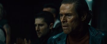 Movie still from “Out of the Furnace” (2013), directed by Scott Cooper – A man in a black leather jacket looking at the camera; Close Up shot, Over the shoulder angle