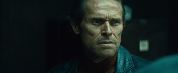 Movie still from “Out of the Furnace” (2013), directed by Scott Cooper – A person wearing a blue shirt; Close Up shot, Over the shoulder angle