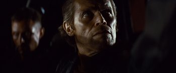 Movie still from “Out of the Furnace” (2013), directed by Scott Cooper – A person looking at the camera; Close Up shot, Low angle