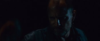 Movie still from “Out of the Furnace” (2013), directed by Scott Cooper – A person with a beard; Close Up shot, Over the shoulder angle