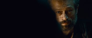 Movie still from “Out of the Furnace” (2013), directed by Scott Cooper – A person with a beard; Extreme Close Up shot, Over the shoulder angle