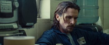 Movie still from “Out of the Furnace” (2013), directed by Scott Cooper – A person with long hair; Close Up shot, Low angle