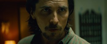 Movie still from “Out of the Furnace” (2013), directed by Scott Cooper – A person with a beard; Close Up shot, Low angle