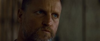 Movie still from “Out of the Furnace” (2013), directed by Scott Cooper – A man with a beard and blue eyes; Close Up shot, Low angle