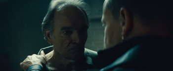Movie still from “Out of the Furnace” (2013), directed by Scott Cooper – Two older men are looking at one another; Close Up shot, Over the shoulder angle