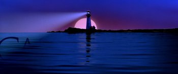 Movie still from “The American President” (1995), directed by Rob Reiner – A light house on the water at sunset; Extreme Wide shot, Low angle