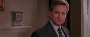 Movie still from “The American President” (1995), directed by Rob Reiner – A person wearing a suit and tie; Close Up shot, Over the shoulder angle