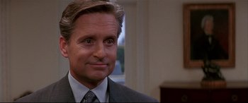 Movie still from “The American President” (1995), directed by Rob Reiner – A person wearing a suit and tie; Close Up shot, Over the shoulder angle