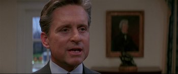 Movie still from “The American President” (1995), directed by Rob Reiner – A person wearing a suit and tie; Close Up shot, Low angle
