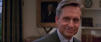 Movie still from “The American President” (1995), directed by Rob Reiner – A person wearing a suit and tie; Close Up shot, Low angle