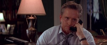 Movie still from “The American President” (1995), directed by Rob Reiner – A person talking on a phone; Close Up shot, High angle
