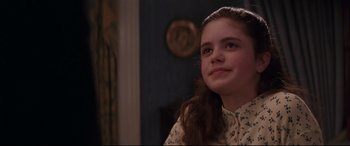 Movie still from “The American President” (1995), directed by Rob Reiner – A young girl sitting in front of a mirror; Close Up shot, Over the shoulder angle