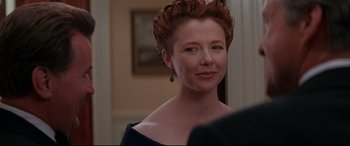 Movie still from “The American President” (1995), directed by Rob Reiner – A person wearing a dress; Close Up shot, Over the shoulder angle