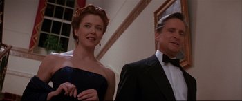 Movie still from “The American President” (1995), directed by Rob Reiner – A man and a woman standing next to each other in formal wear; Medium shot, Low angle