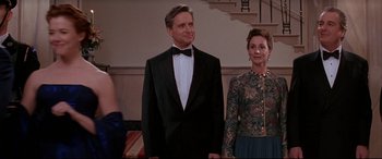 Movie still from “The American President” (1995), directed by Rob Reiner – A man and a woman dressed in formal wear; Medium shot, Over the shoulder angle