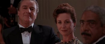 Movie still from “The American President” (1995), directed by Rob Reiner – An older man and a younger woman in formal wear; Close Up shot, Low angle