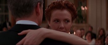 Movie still from “The American President” (1995), directed by Rob Reiner – A man and a woman are hugging each other in a room; Close Up shot, Over the shoulder angle