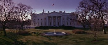 Movie still from “The American President” (1995), directed by Rob Reiner – A fountain in front of the white house in washington , d; Extreme Wide shot, Low angle