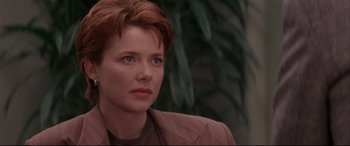 Movie still from “The American President” (1995), directed by Rob Reiner – A person with short hair; Close Up shot, Over the shoulder angle