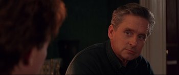 Movie still from “The American President” (1995), directed by Rob Reiner – A person sitting at a table; Close Up shot, Over the shoulder angle
