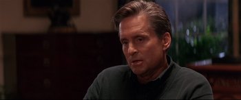 Movie still from “The American President” (1995), directed by Rob Reiner – A person sitting in a chair; Close Up shot, Over the shoulder angle