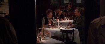 Movie still from “The American President” (1995), directed by Rob Reiner – A group of people sitting at a dinner table; Wide shot, High angle
