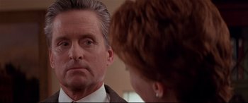 Movie still from “The American President” (1995), directed by Rob Reiner – A man and a woman looking at one another in a mirror; Close Up shot, Over the shoulder angle
