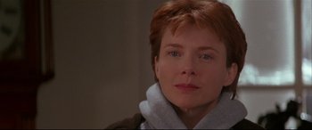 Movie still from “The American President” (1995), directed by Rob Reiner – A person with short red hair; Close Up shot, Over the shoulder angle