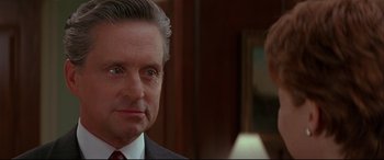 Movie still from “The American President” (1995), directed by Rob Reiner – A person wearing a suit and tie; Close Up shot, Over the shoulder angle
