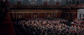Movie still from “The American President” (1995), directed by Rob Reiner – A large group of people in a large auditorium; Extreme Wide shot, High angle
