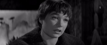 Movie still from “The Apartment” (1960), directed by Billy Wilder – A black - and - white photo of a woman with short hair; Close Up shot, High angle