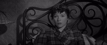 Movie still from “The Apartment” (1960), directed by Billy Wilder – A black - and - white photo of a woman with short hair; Close Up shot, High angle