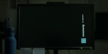 Movie still from “The Assistant” (2019), directed by Kitty Green – A television screen with a black background; Extreme Close Up shot, Low angle