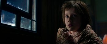 Movie still from “The BFG” (2016), directed by Steven Spielberg – A little girl sitting in front of a window; Close Up shot, Over the shoulder angle