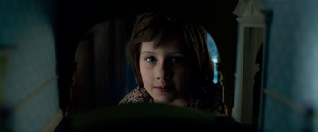 Movie still from “The BFG” (2016), directed by Steven Spielberg – A little girl looking into a mirror in the dark; Close Up shot, High angle