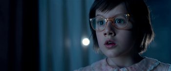 Movie still from “The BFG” (2016), directed by Steven Spielberg – A little girl wearing glasses and a pink dress; Close Up shot, Low angle