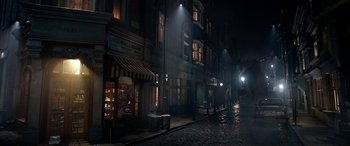 Movie still from “The BFG” (2016), directed by Steven Spielberg – A street with a bunch of buildings on the side of the street; Extreme Wide shot, High angle