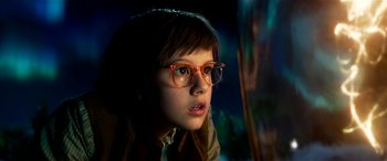 Movie still from “The BFG” (2016), directed by Steven Spielberg – A young girl wearing glasses looking at the camera; Close Up shot, Over the shoulder angle