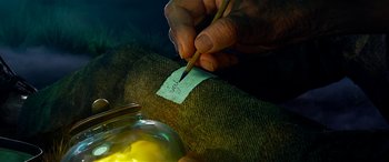 Movie still from “The BFG” (2016), directed by Steven Spielberg – A person writing on a piece of paper with a pencil; Extreme Close Up shot, High angle
