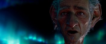 Movie still from “The BFG” (2016), directed by Steven Spielberg – An old man with a beard is looking at the camera; Close Up shot, Low angle