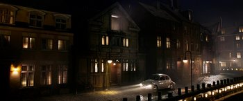Movie still from “The BFG” (2016), directed by Steven Spielberg – A car parked in front of a house at night; Extreme Wide shot, High angle