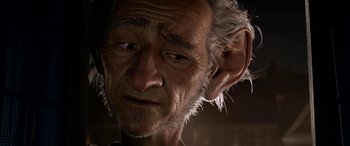 Movie still from “The BFG” (2016), directed by Steven Spielberg – An old man with a white beard is looking to his left; Close Up shot, Over the shoulder angle